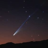 Comet C/2025 A6 "Lemmon" casts its long, blue-ish tail across the evening sky over the Tucson Mountains